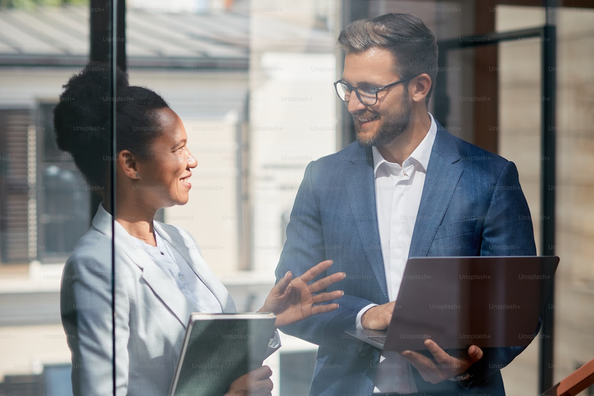 Financial adviser reviewing client portfolio with CRM software